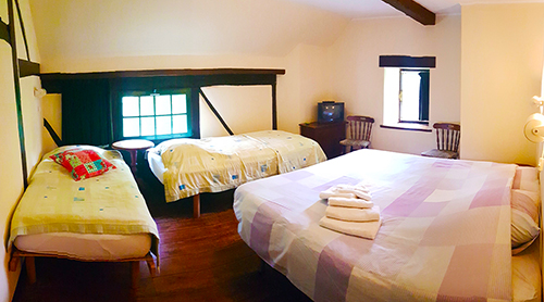Our quadruple room with single beds. (R4)